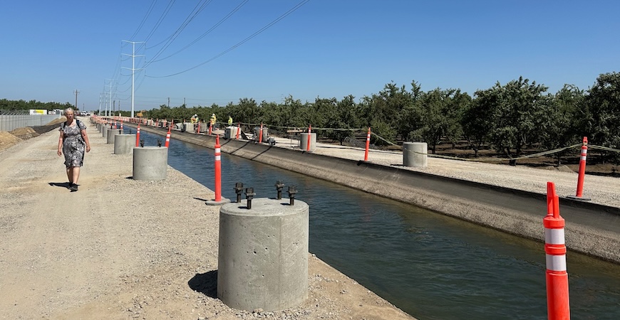Photo depicts concrete supports lining a canal in Keyes, California.