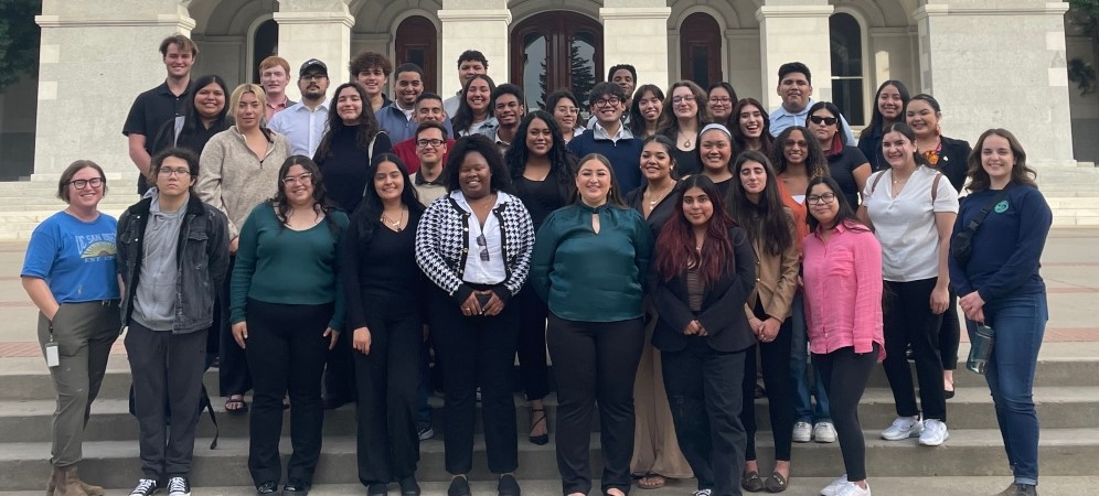 The legislative simulation class stand on the steps of the capitol building in Sacramento