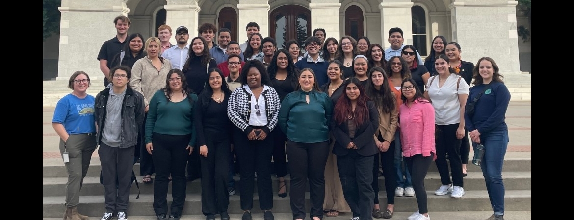 The legislative simulation class stand on the steps of the capitol building in Sacramento