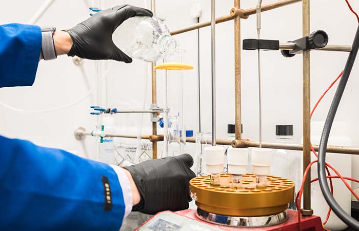 scientist performing chemistry research in a UC Merced lab